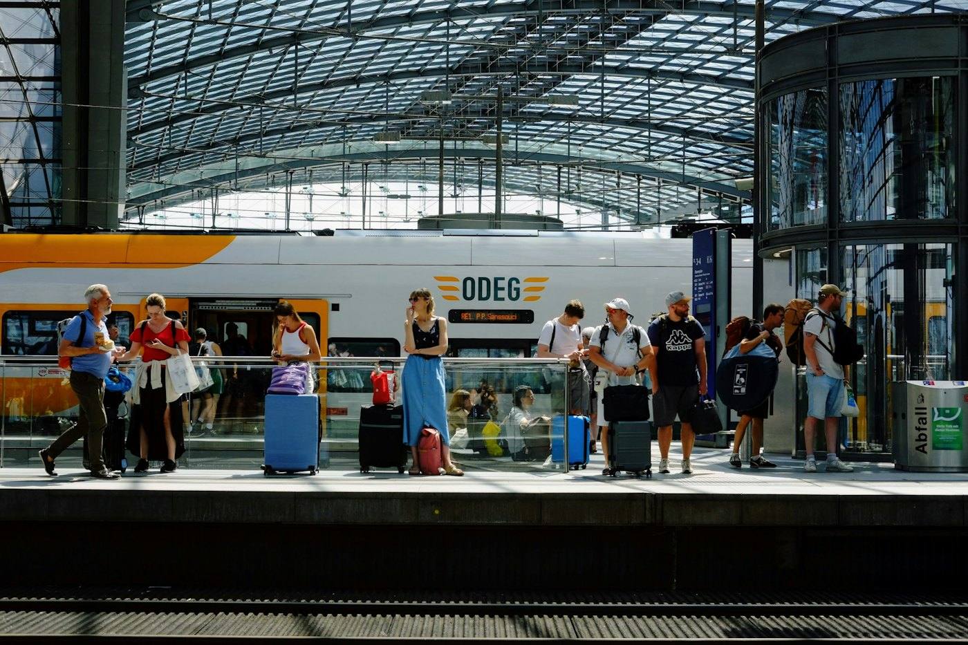 Travellers with suitcases on a platform, Berlin Hauptbahnhof